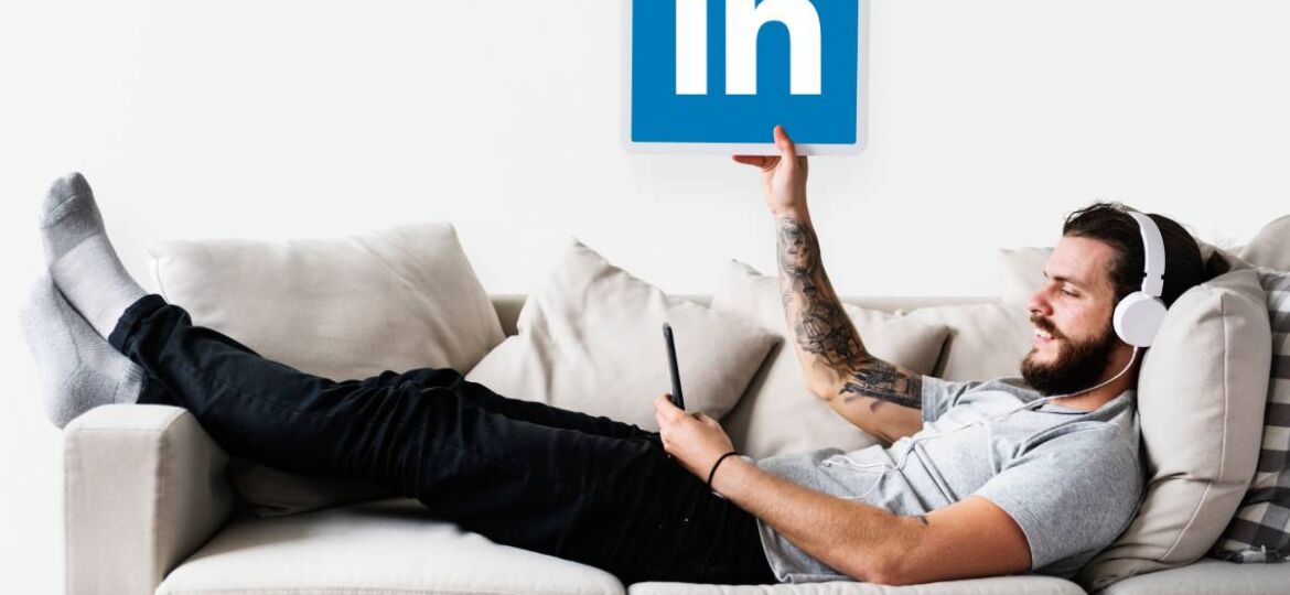 person-holding-linkedin-icon (Demo)